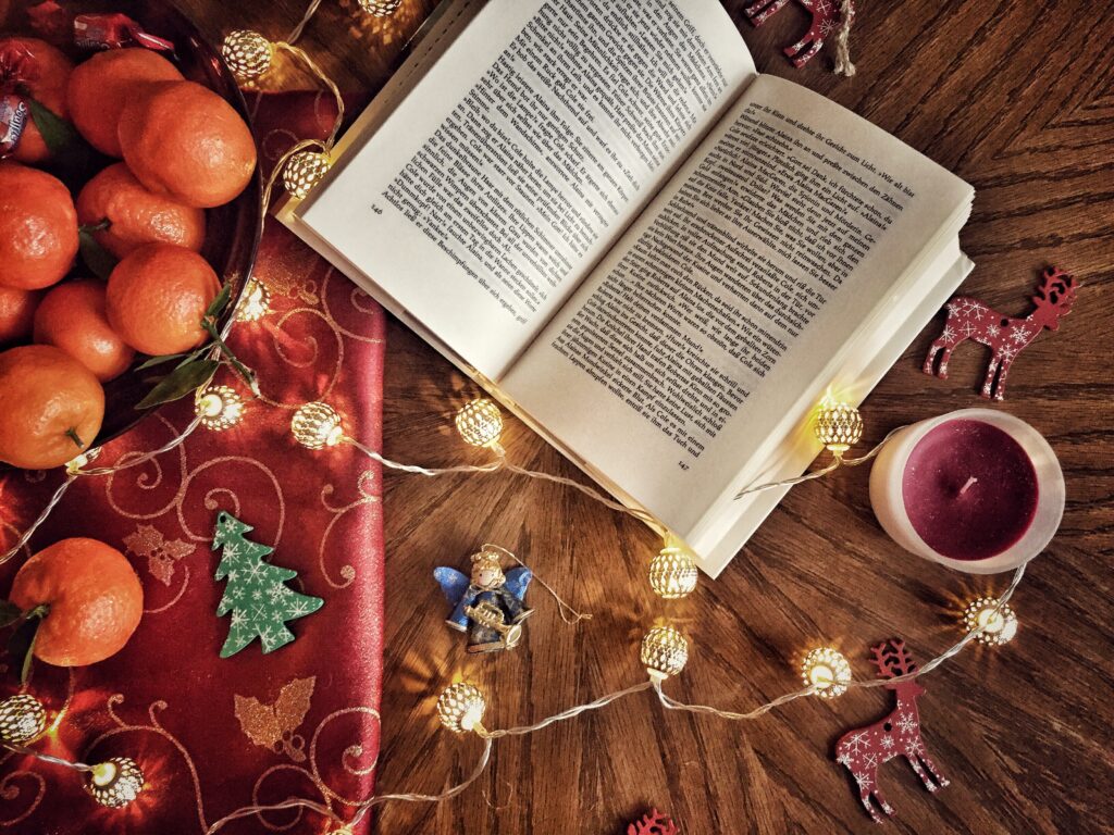 A book sitting on a Christmas-themed table